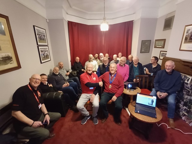 Members of The District Club gathered around the Kilgrimol Room, the President seated in the middle wearing the chain of office.