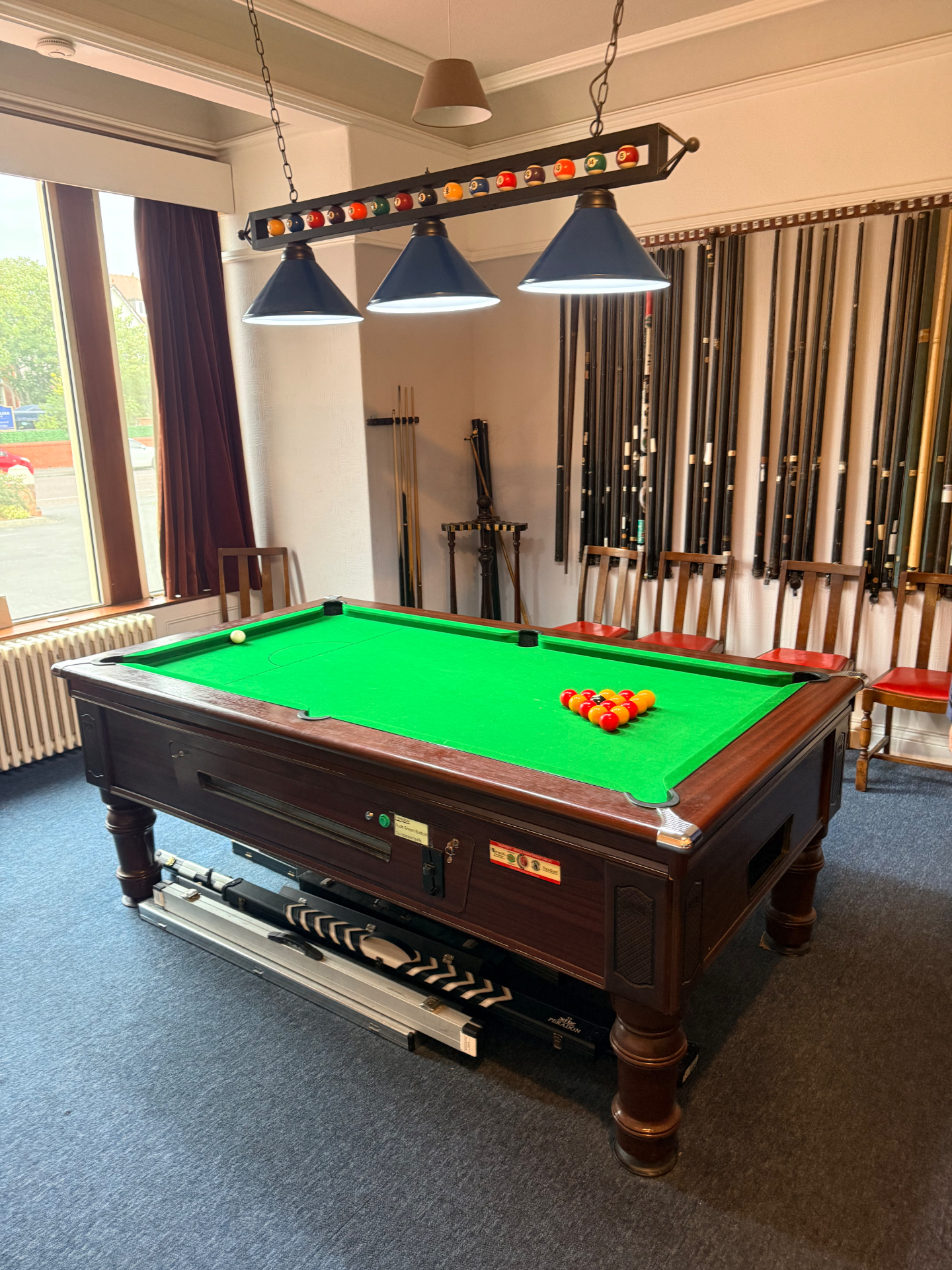 The pool table set for a fresh break in the games room.